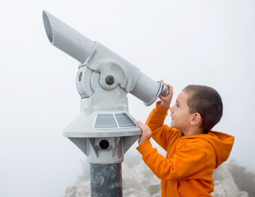 Boy looking into the sky